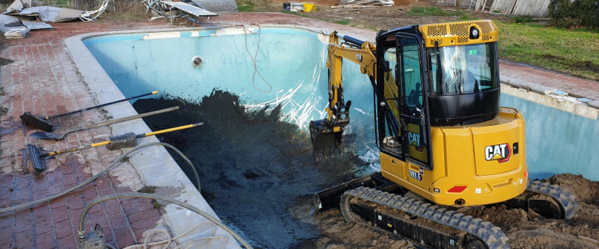 excavator working in a swimming pool